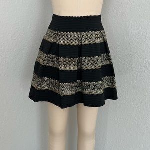 New black Flared skirt with pleats and gold stitching size medium
